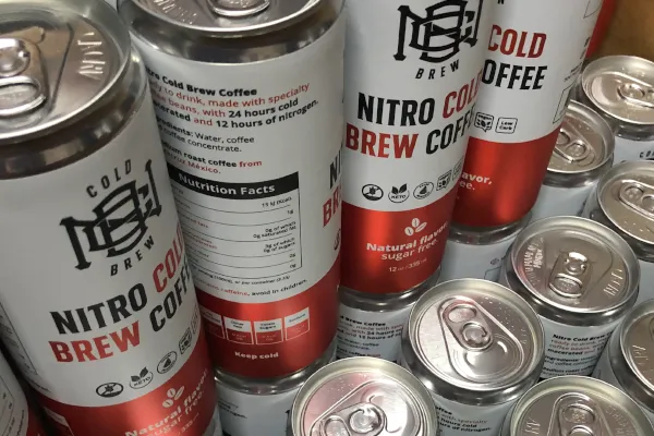 Nomad Cold Brew cans and bottles on retail shelves
