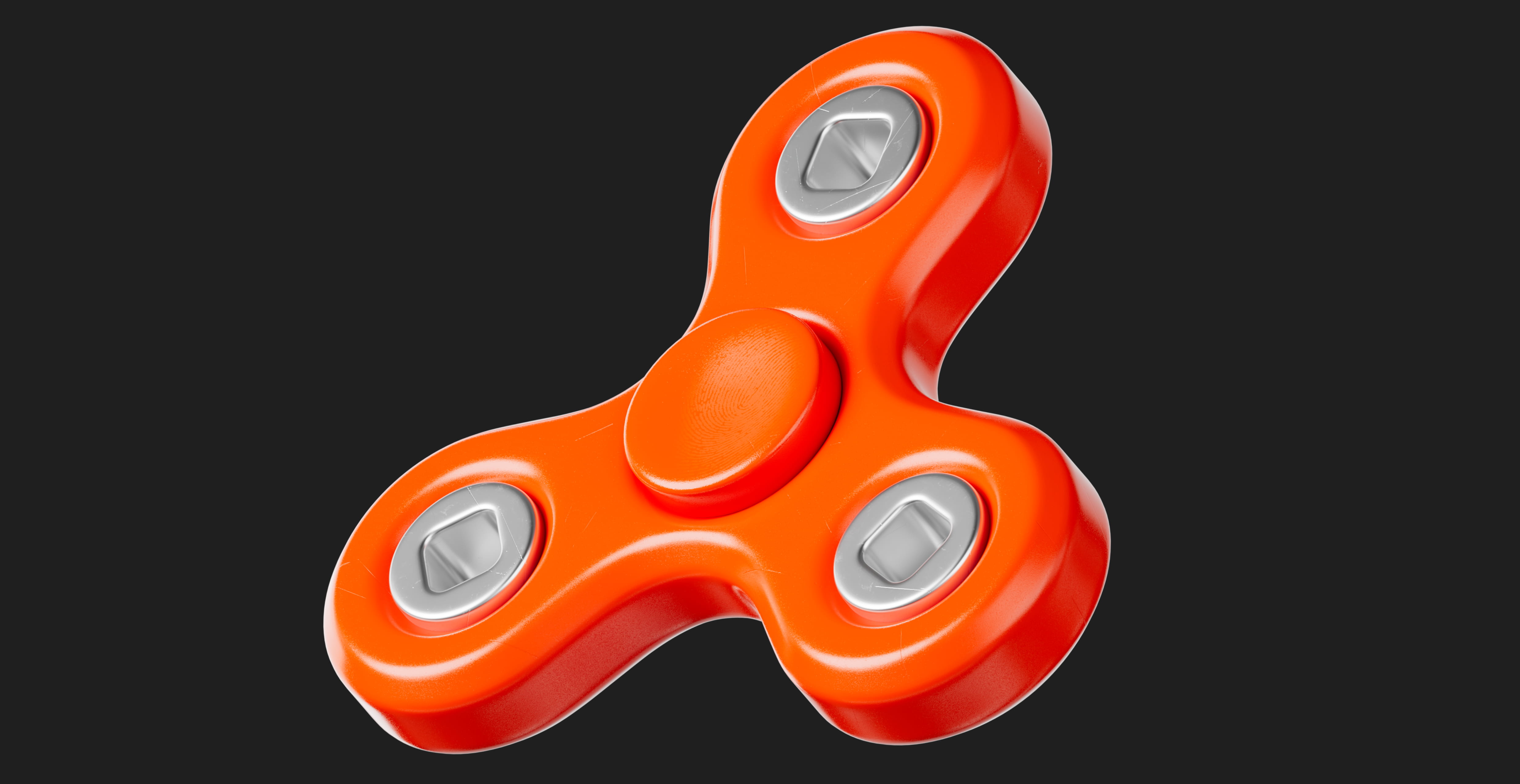 Orange three-pronged fidget spinner with silver bearings on a dark background.