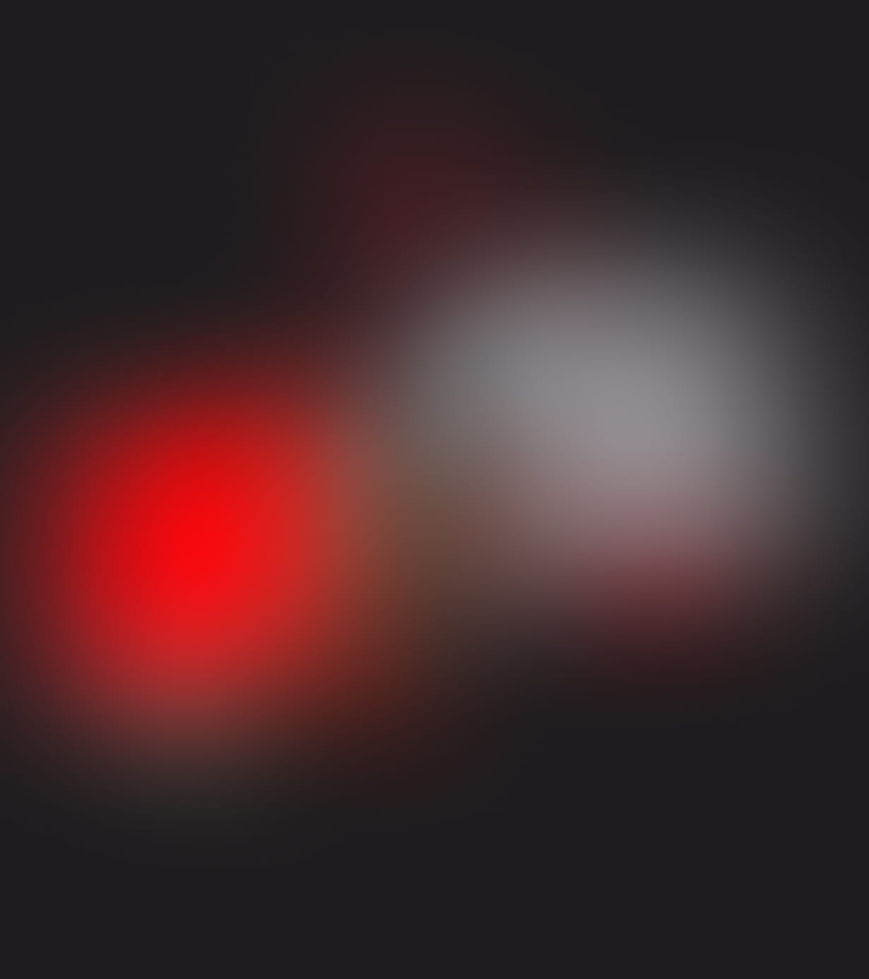 Blurred image with dominant red and white colors on a dark background.