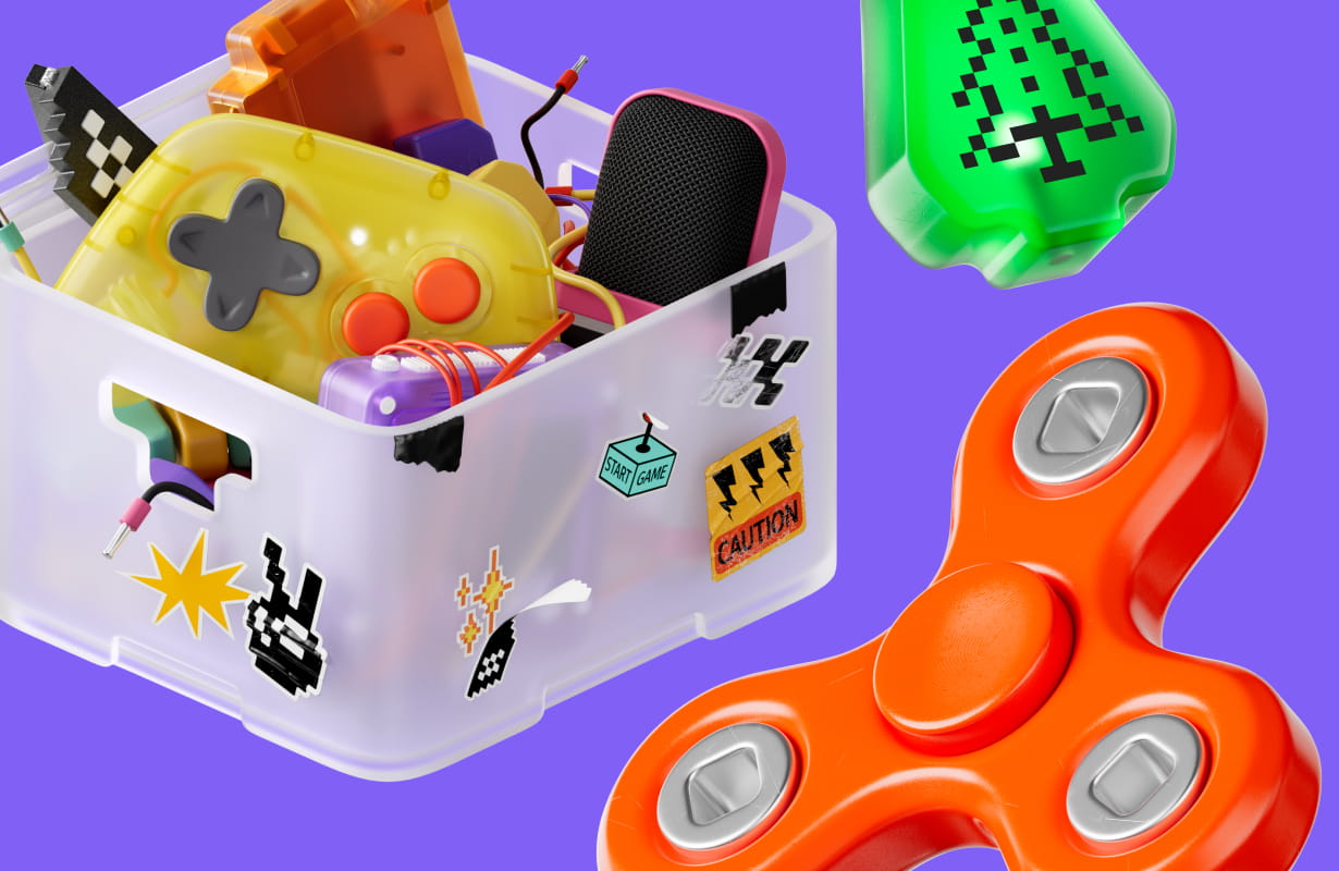 Transparent box filled with colorful gaming gadgets and controllers next to a red fidget spinner on a purple background.