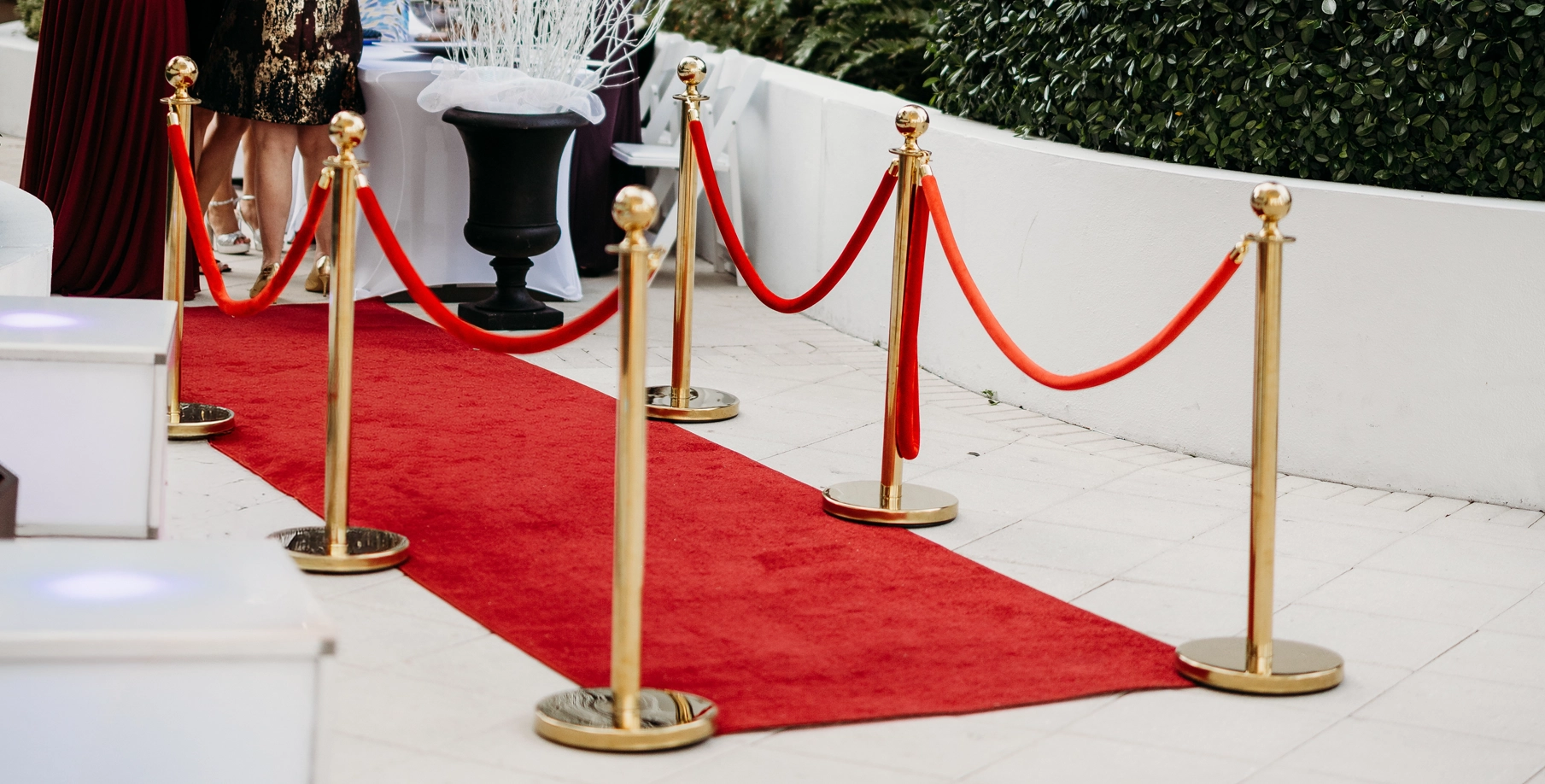 Our DJ Tampa Red Carpet & Stanchion Set with our light up acrylic risers paired with them.