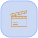 Gold Movie Clapper Icon in a light blue square with rounded corners.