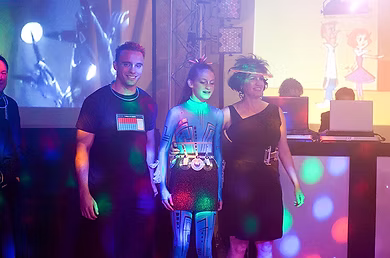 Photo taken at a bat mitzvah event with our dance floor lights washing over the family.