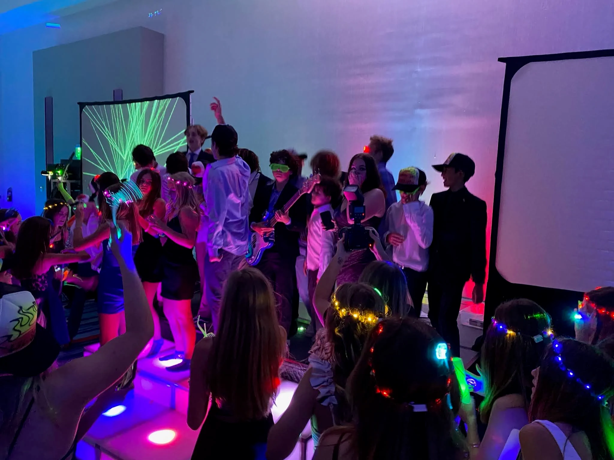 Photo taken at a Bar or Bat Mitzvah where a group of the mitzvah kids are dancing on our acrylic light up risers.