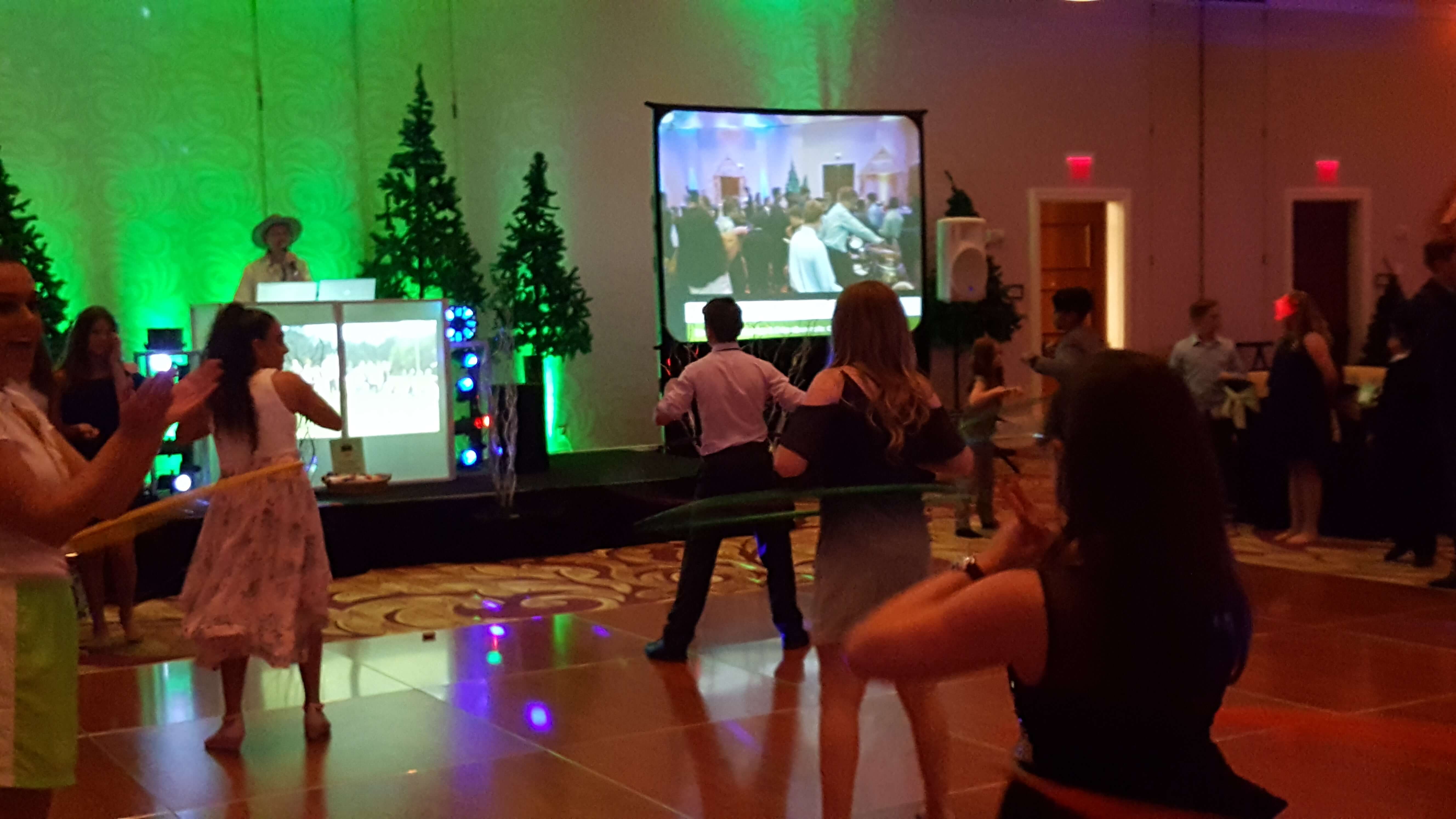 Photo taken at a corporate holiday party of the company participating in a hula hoop contest.