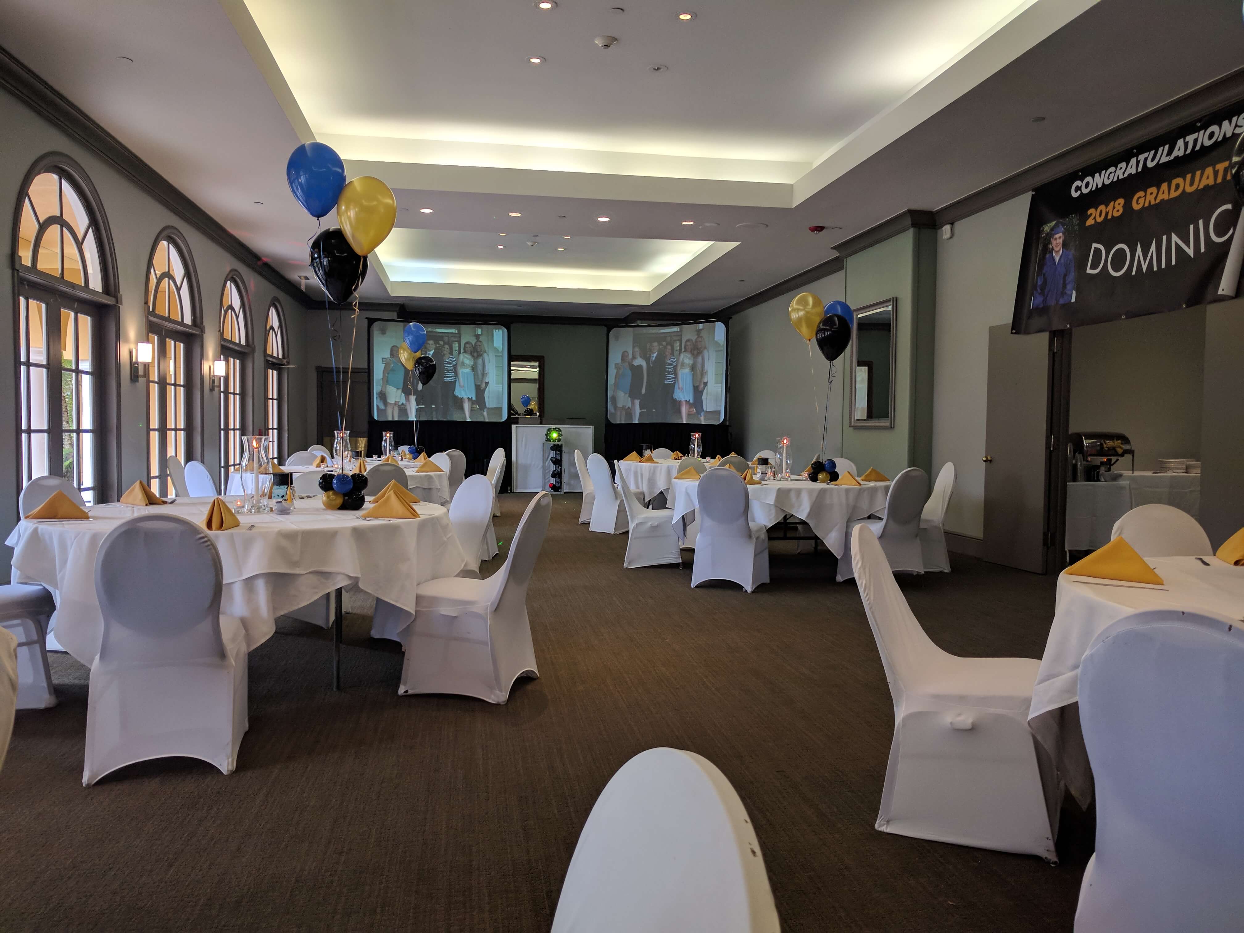 Picture of a decorated event hall for a private high school graduation family event.