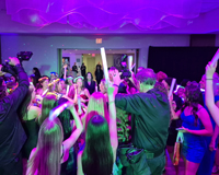 Photo taken at a private party of the grand entrance of the birthday girl with a night club theme happening.