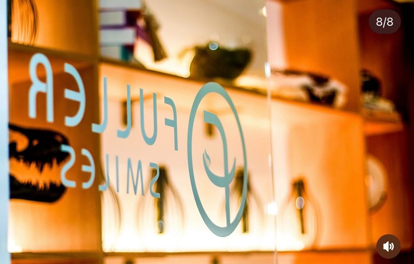 [background image] friendly staff answering questions (for a optician store and optometry clinic)