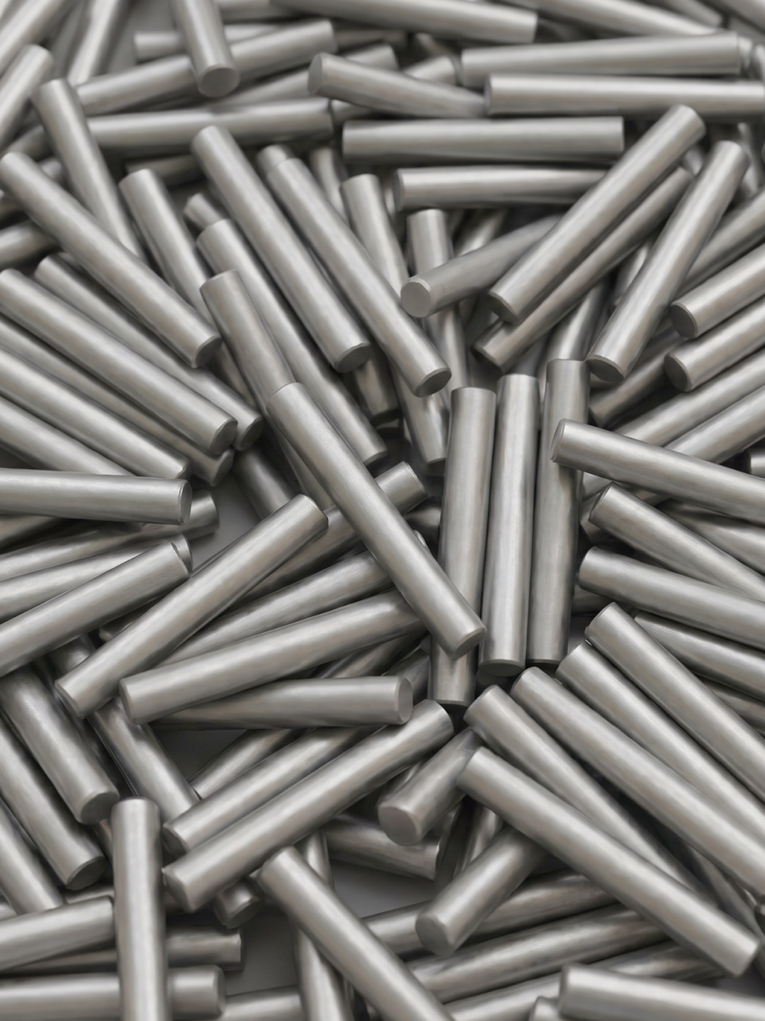 A smooth, cylindrical metal rod with a dull silver finish isolated on a white background. Shot blasting pre treatment.