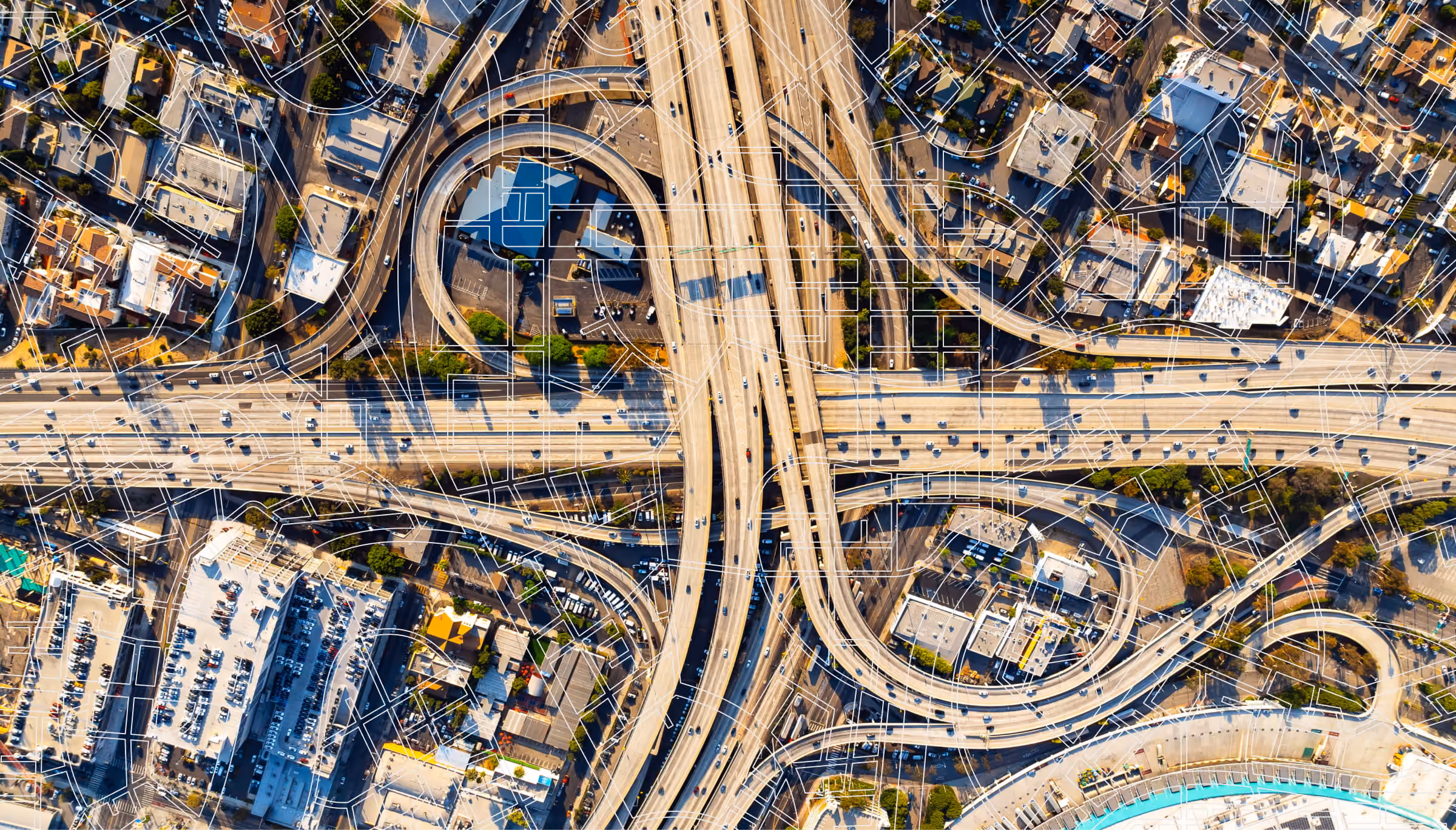 Aerial photo of a highway interchange in a city.