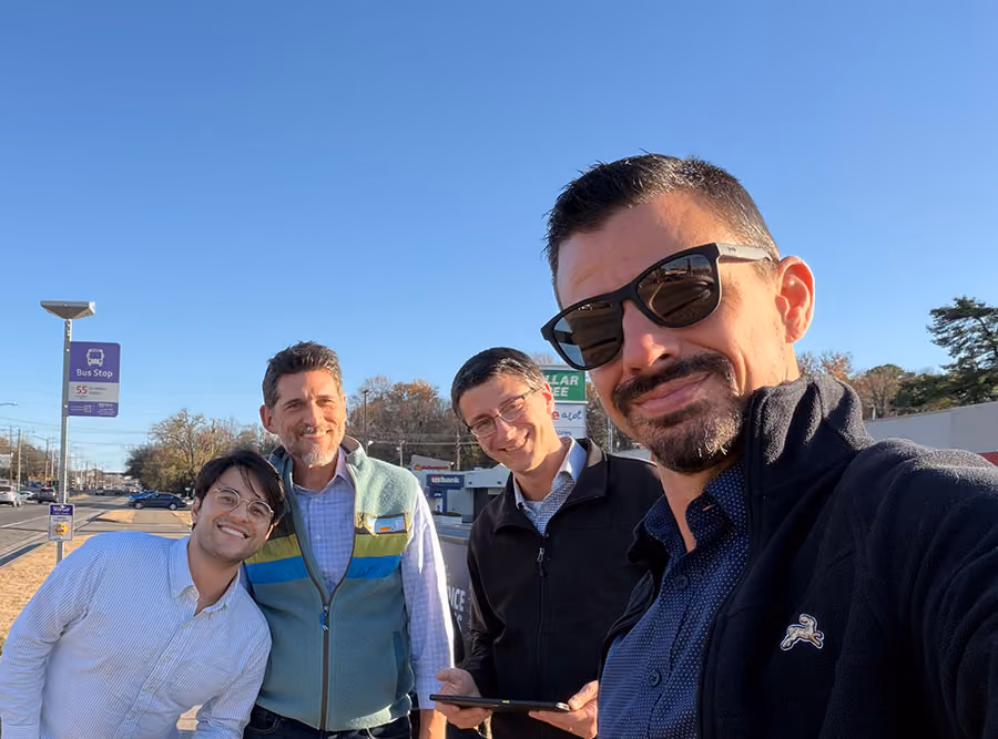 Group selfie of Swiftly employees outdoors during a WeGo Public Transit site visit.