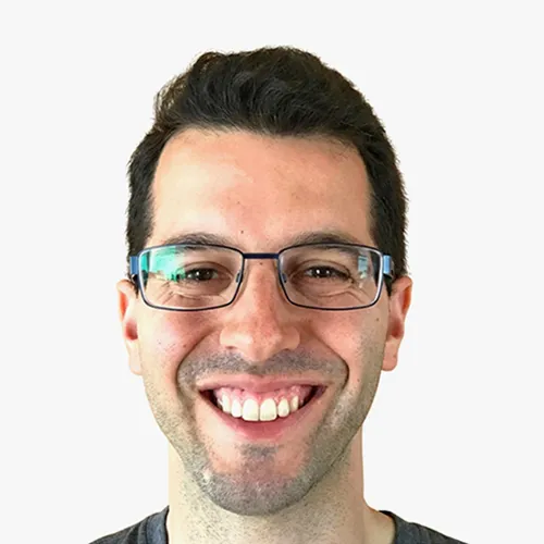 Headshot of Adam Cath smiling against a plain background.