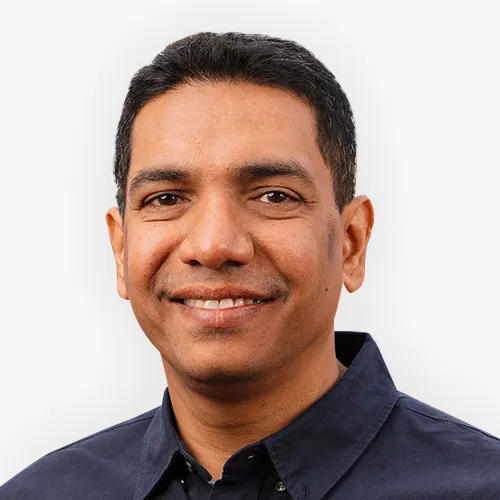 Headshot of Ritesh Warade smiling against a plain background.