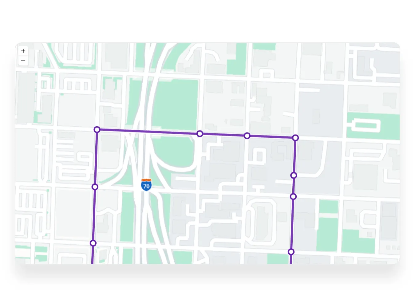 Map section showing a purple outlined route with circular checkpoints, crossing Interstate 70 and surrounding city blocks with green park areas.