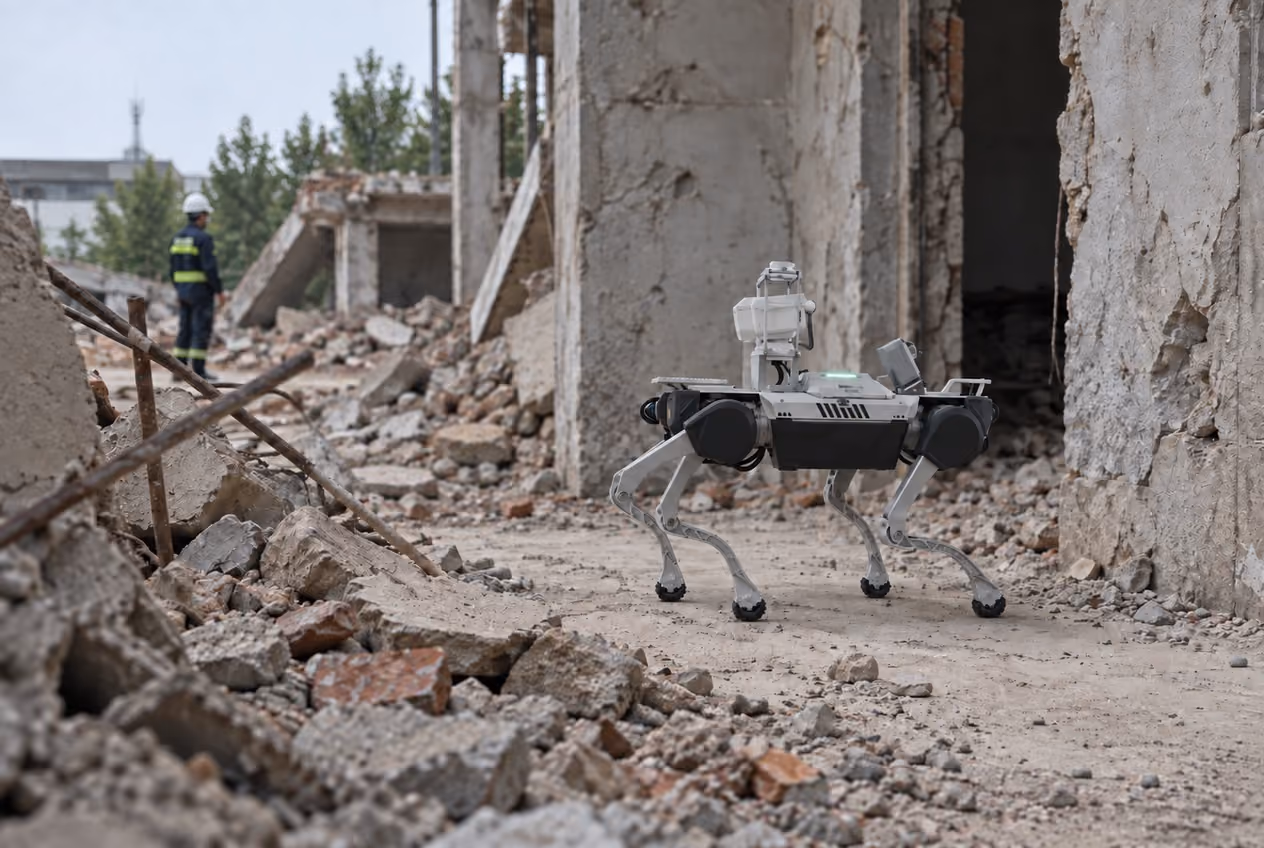 Quadruped with protected inspection camera surveying a clear path at a rubble training site.