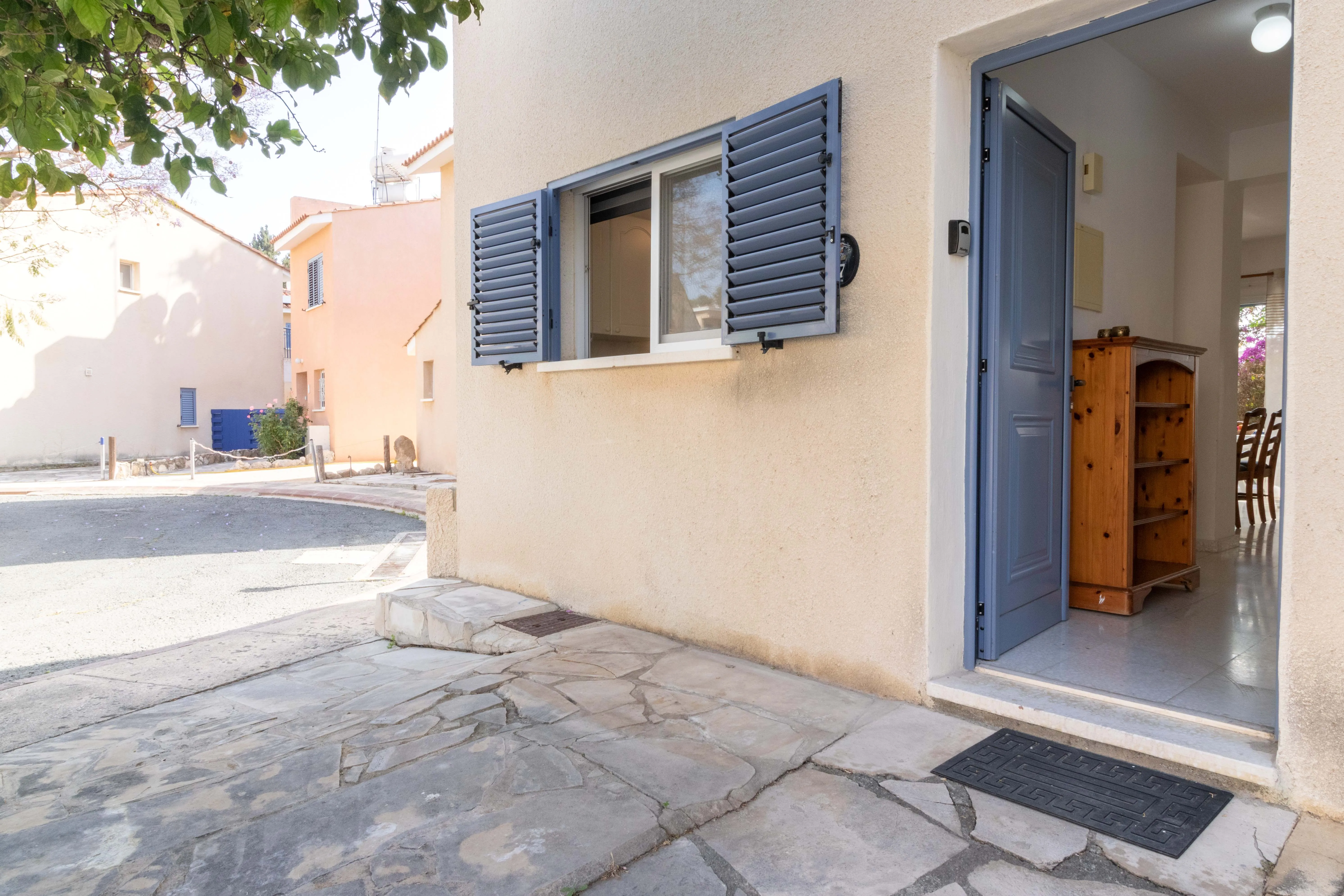 Entrance door of Villa Nadezda with blue shutters, Paradise Gardens Paphos