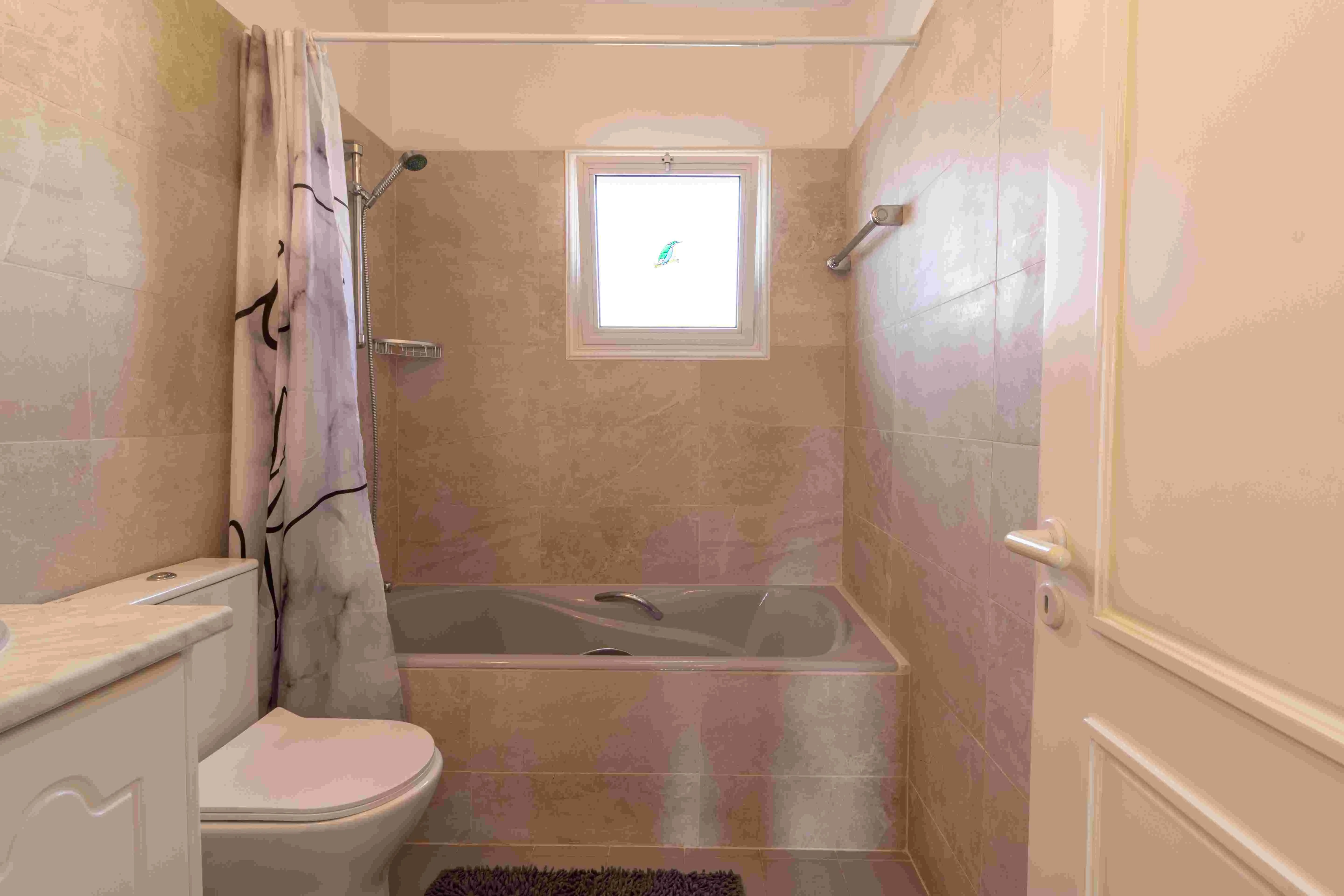 Bathroom with bath and shower curtain at Villa Nadezda