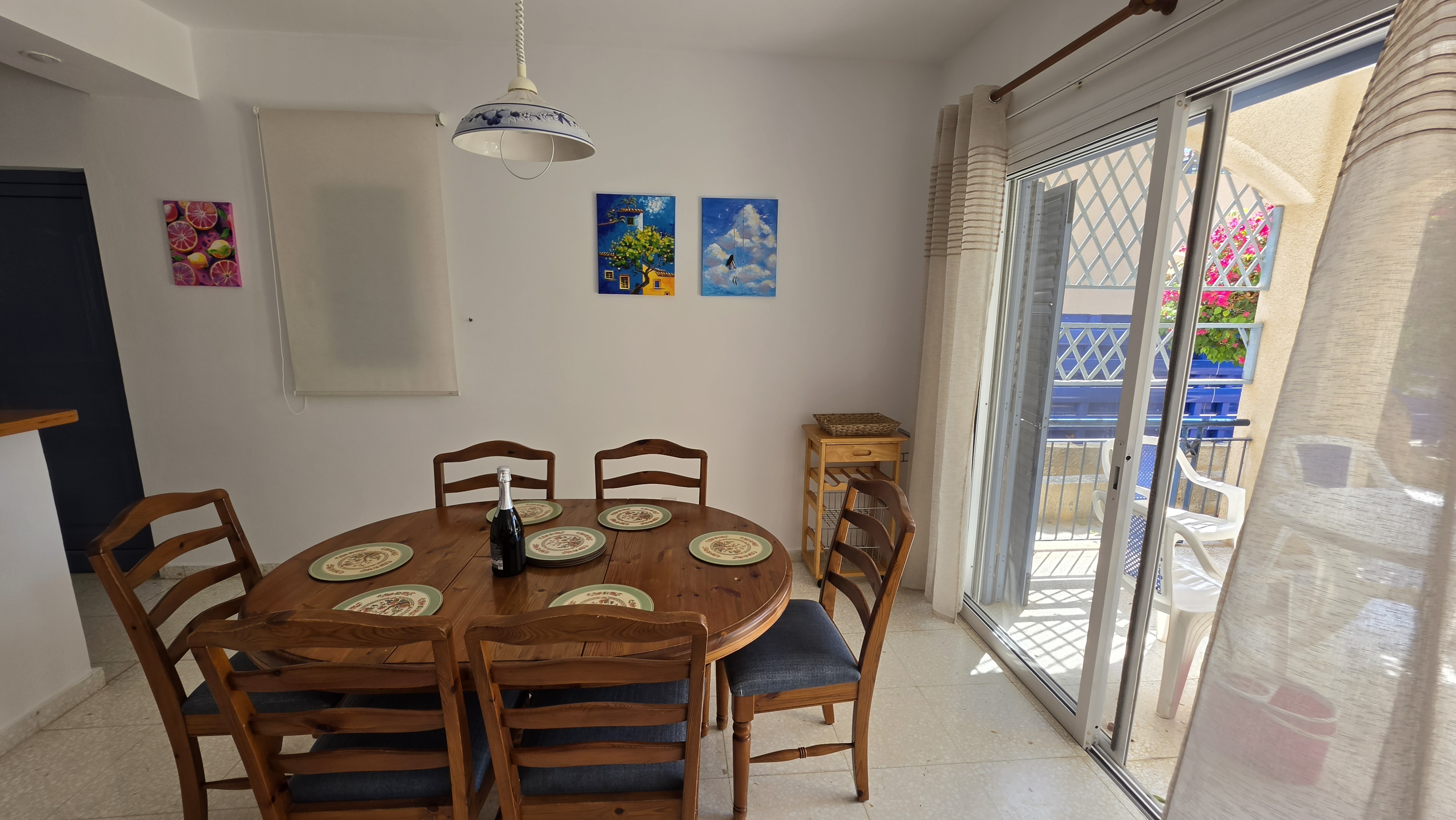 Dining table laid for six at Villa Nadezda, with doors onto the patio