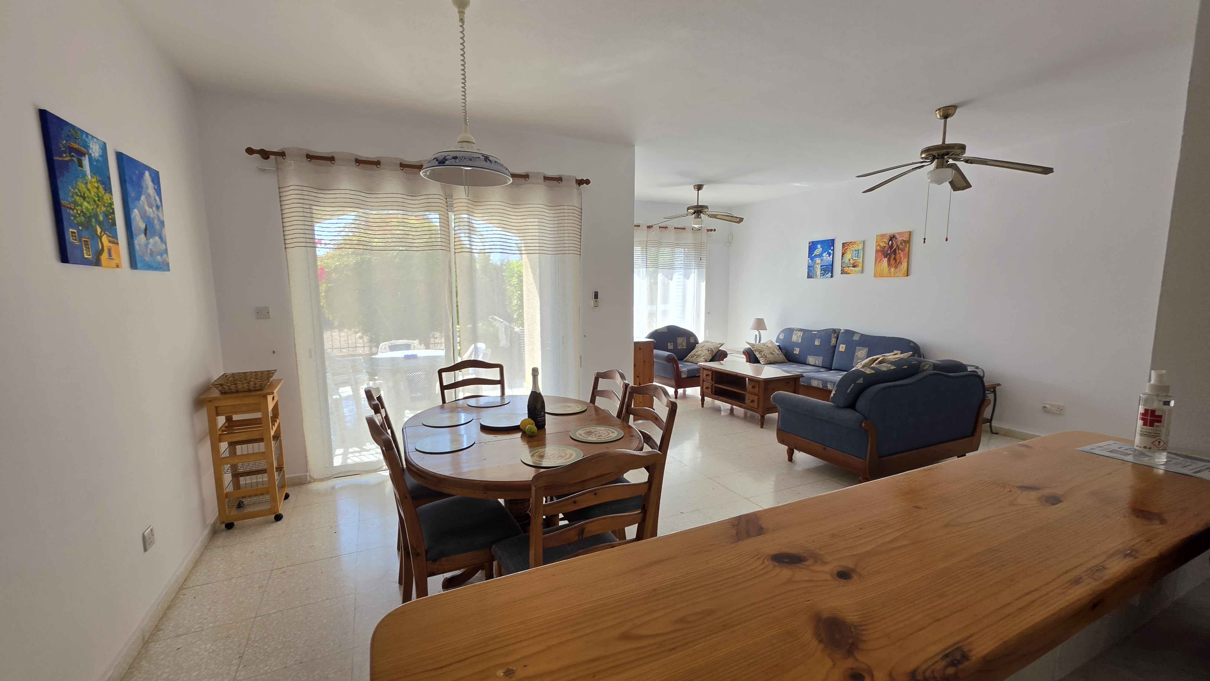 Open-plan dining and living area at Villa Nadezda, Kato Paphos