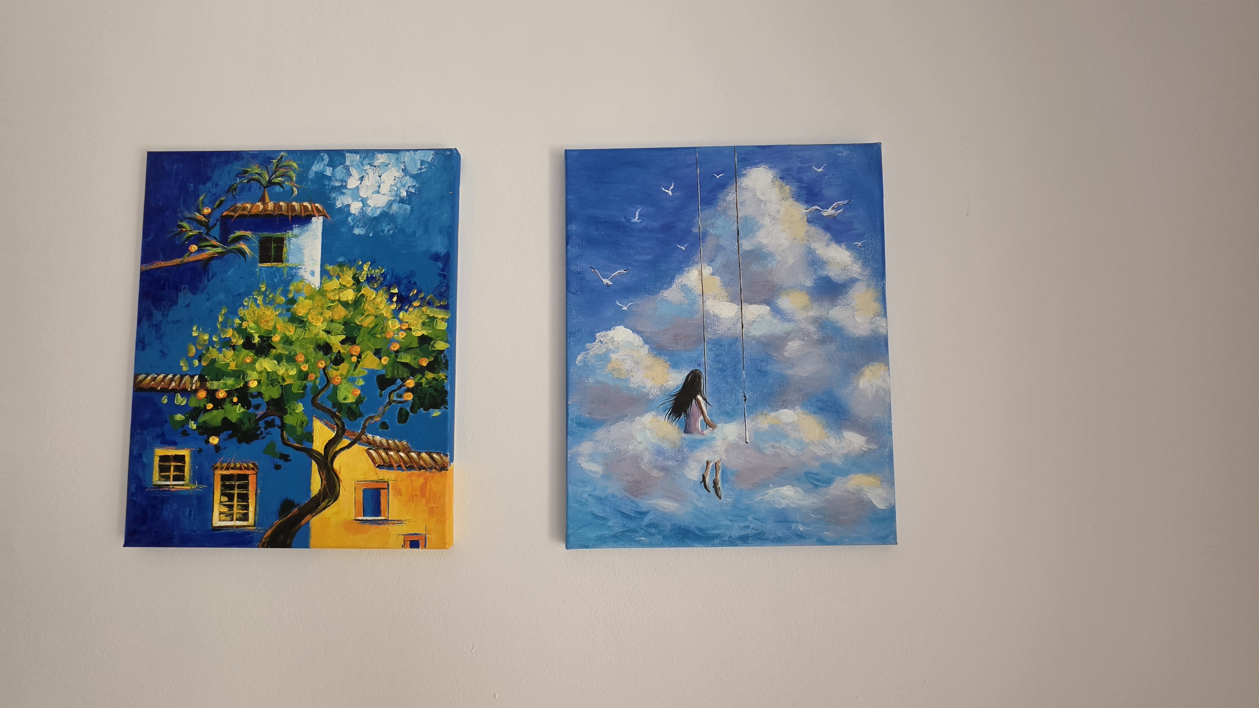 Two handmade paintings in the dining area at Villa Nadezda, Paphos