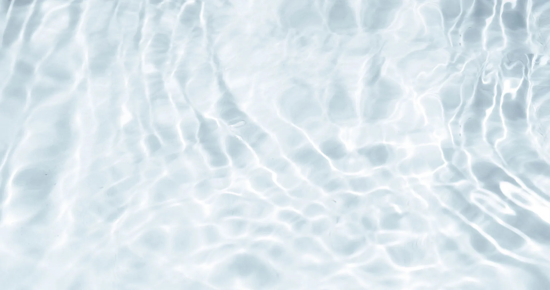 Clear water ripple reflections creating a relaxing spa and wellness background