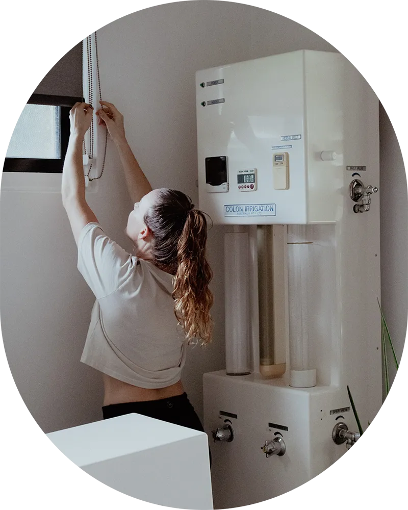 Steph preparing the colon hydrotherapy room at Glow Colonics Cairns