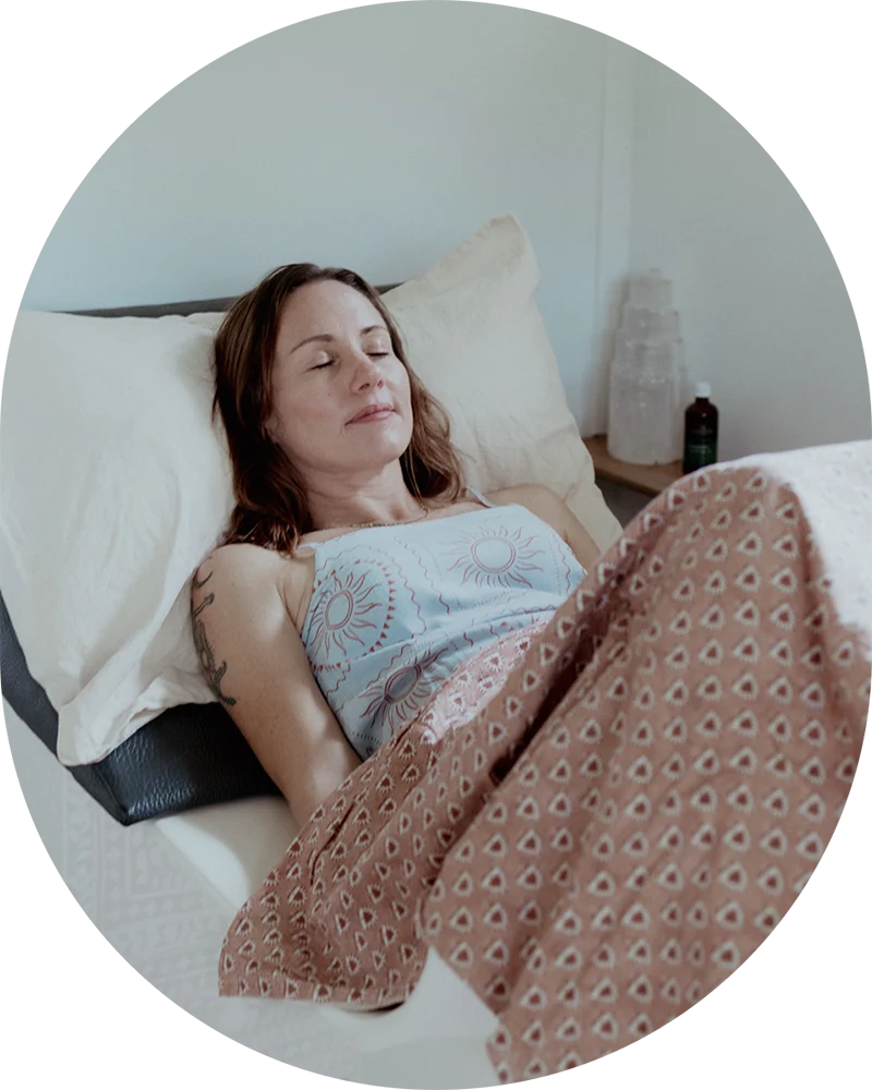 Client relaxing during a private colon hydrotherapy detox session at Glow Colonics