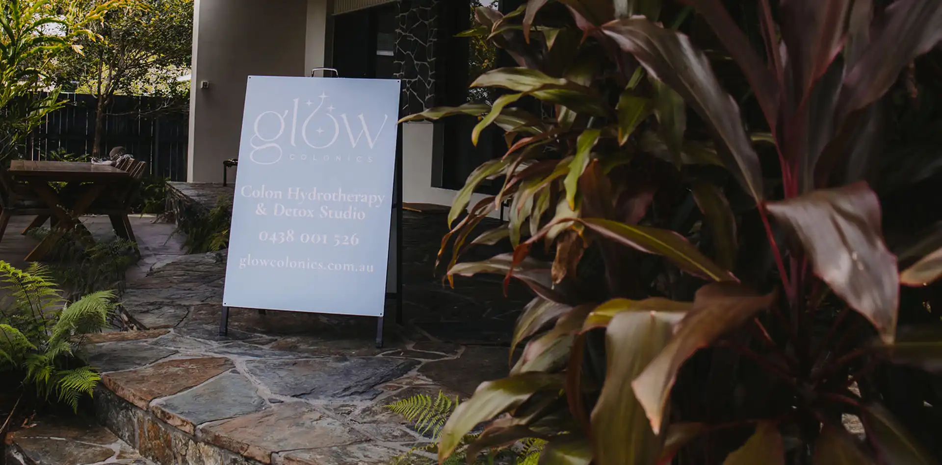 Tropical outdoor entrance to Glow Colonics colon hydrotherapy and detox studio in Cairns