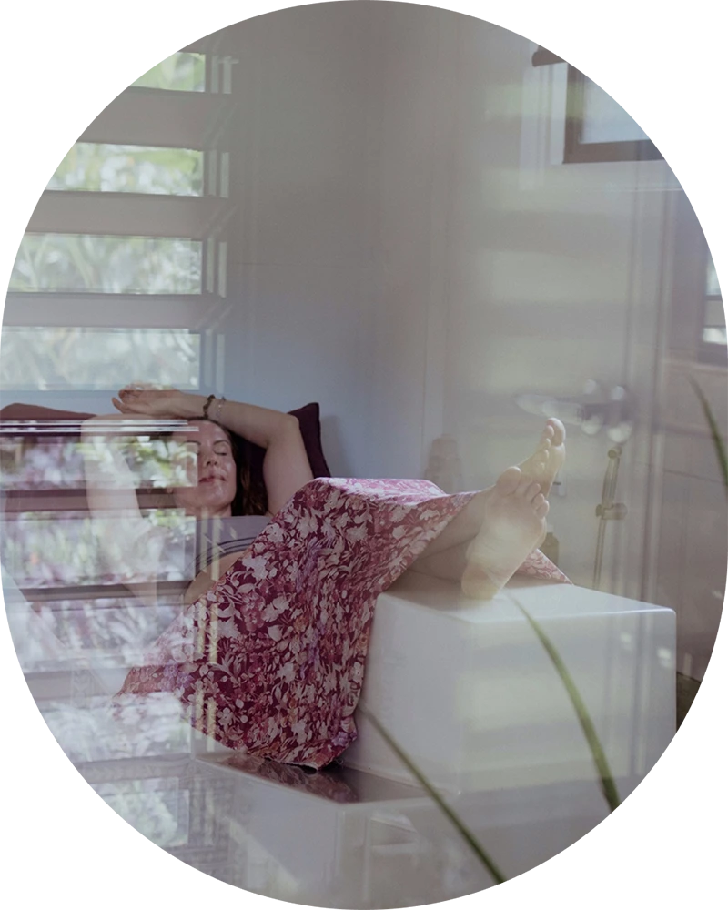 Wellness client relaxing after an infrared sauna and detox session at Glow Colonics