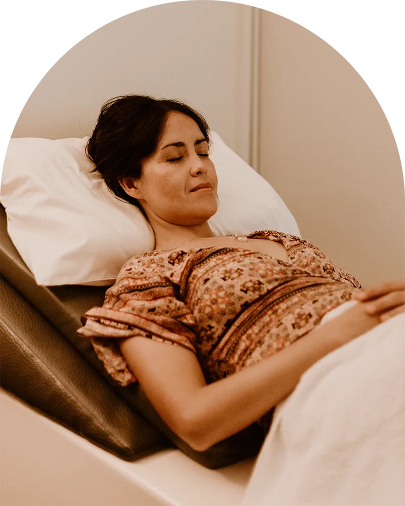 Client relaxing during a private colon hydrotherapy session at Glow Colonics