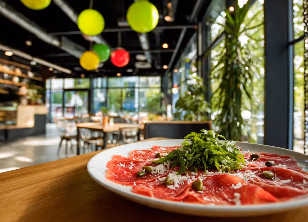 Beef carpaccio with arugula and parmesan served at the Italian restaurant of the Ysotop Hotel in Grenoble.