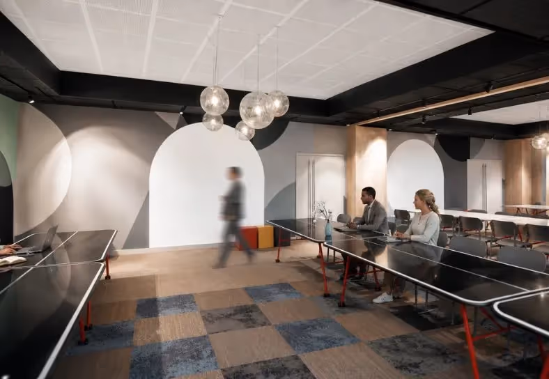Electron room in subcommittee configuration with small tables and dimmed lighting at the Ysotop Grenoble hotel.