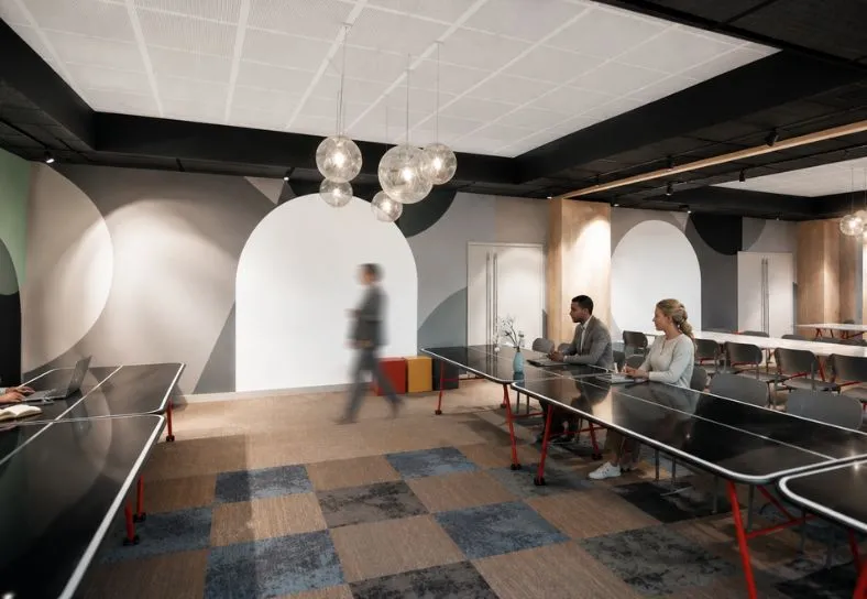 Salle Electron en configuration sous-commission avec petites tables et éclairage tamisé à l'hôtel Ysotop Grenoble.