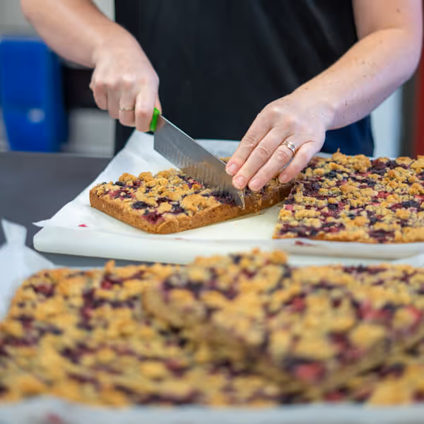Fresh baking being cut in the Willows kitchen