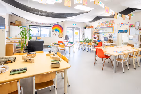 The bright Saplings room at Willows with low tables set for play