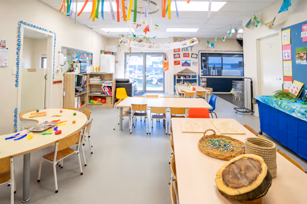 The Willows room for 3 to 5 year olds, with natural materials on the tables