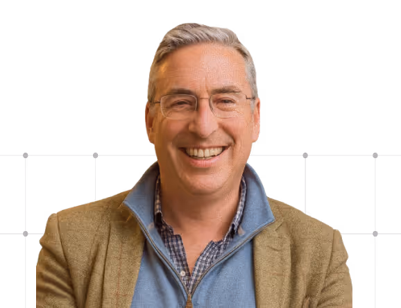 a man smiling at the camera