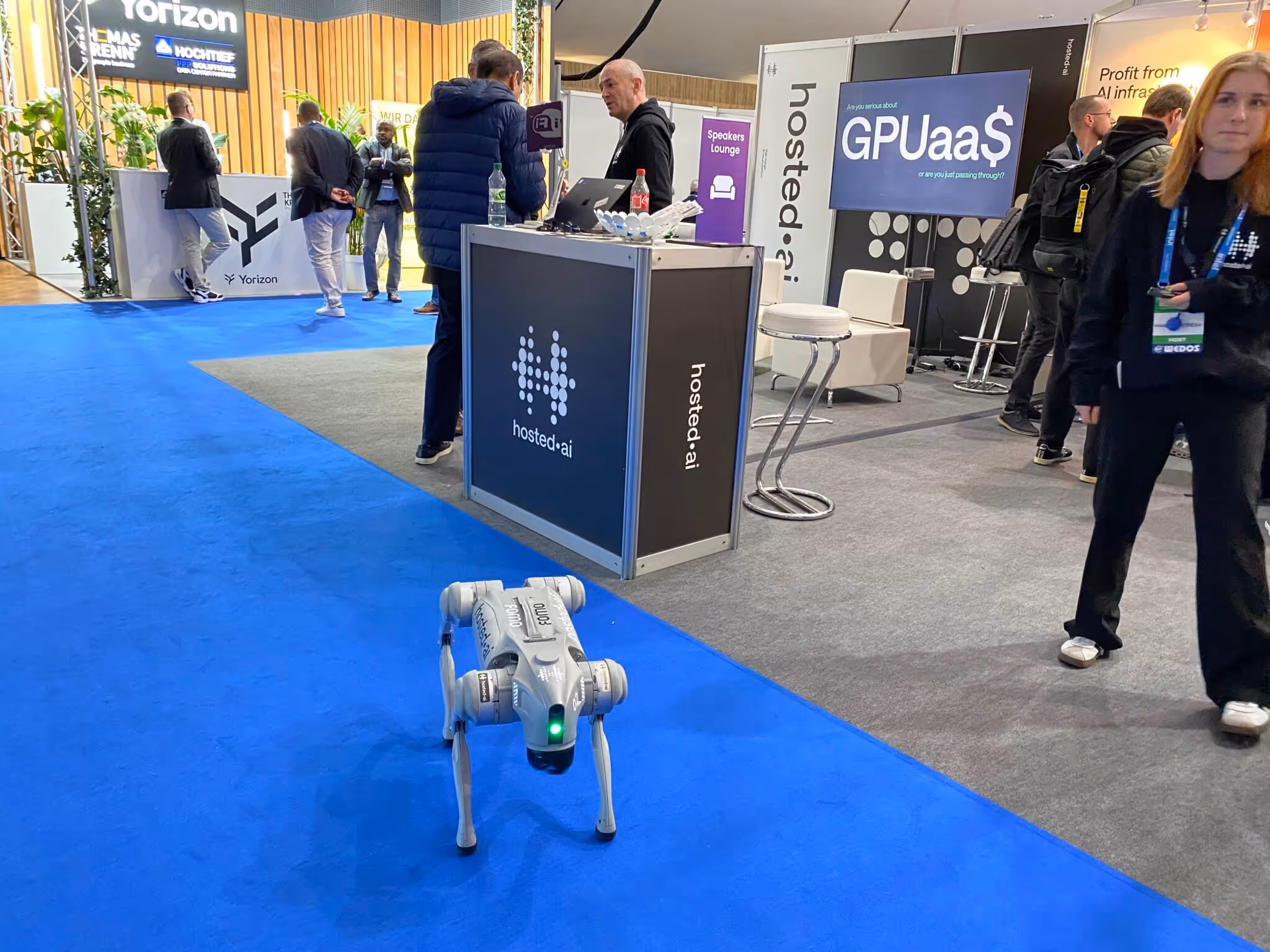a small robot on a blue carpet