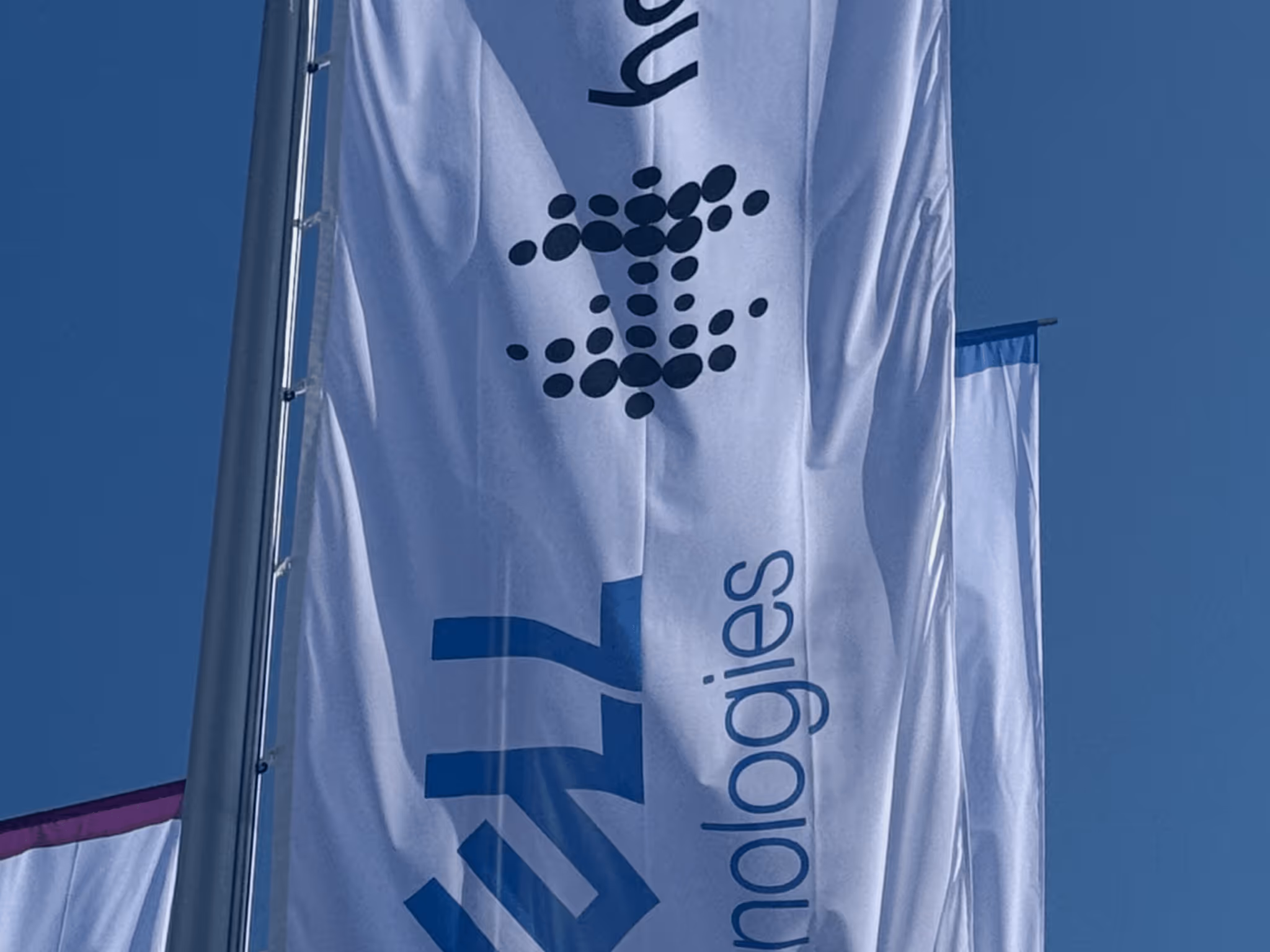 a white flag with blue text