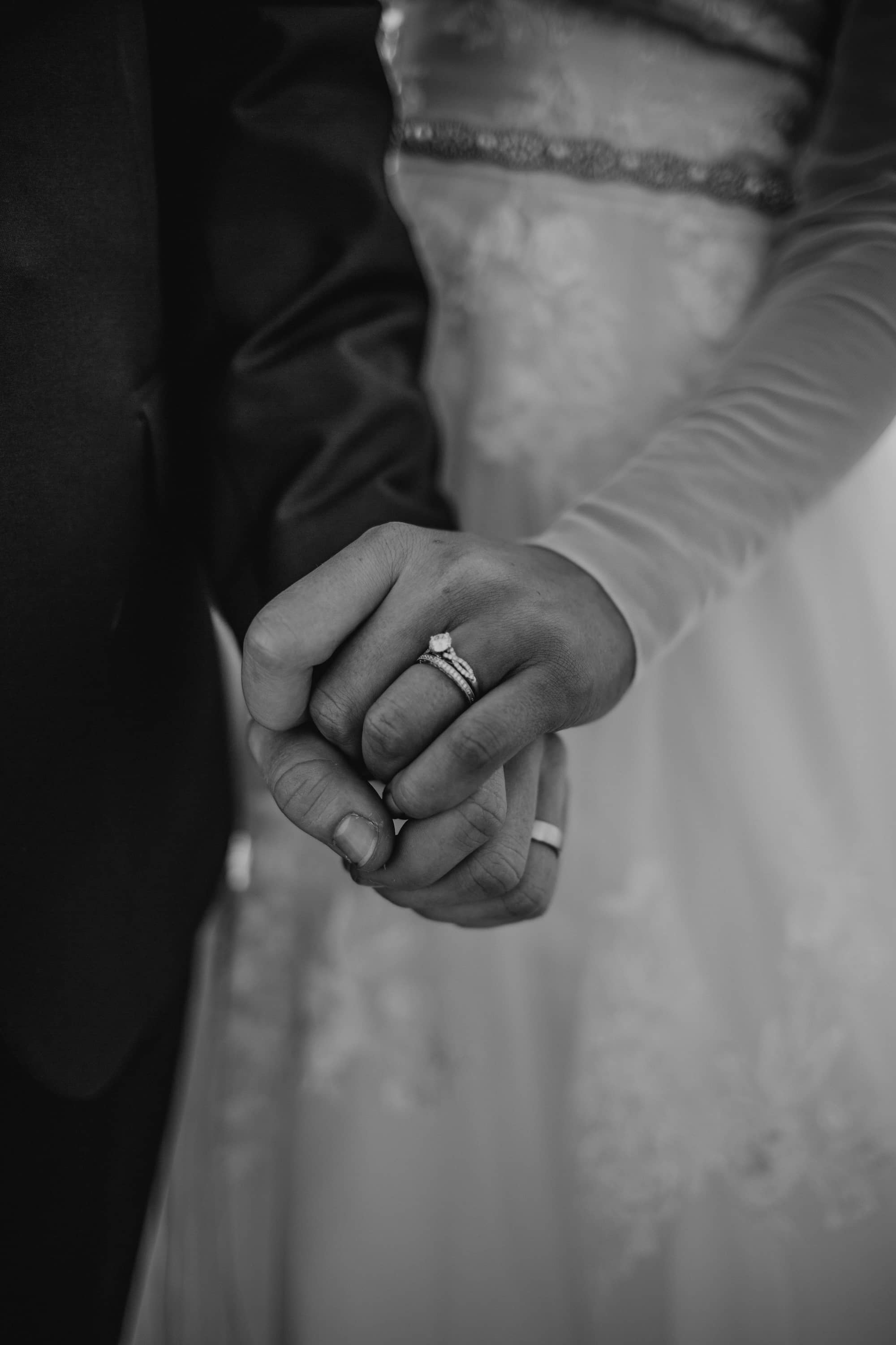 A shot of wedded couples holding hands