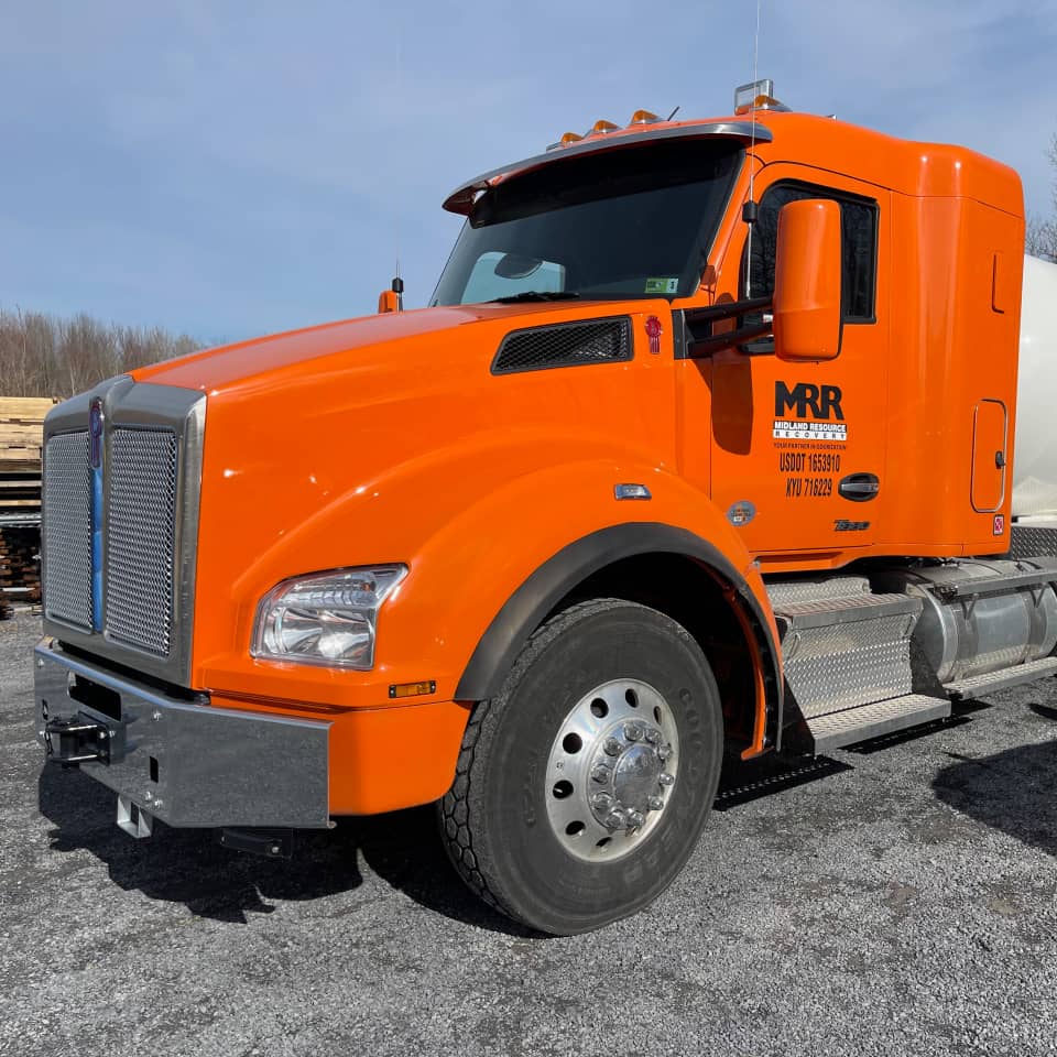 An orange MRR semi truck, from the company's timeline