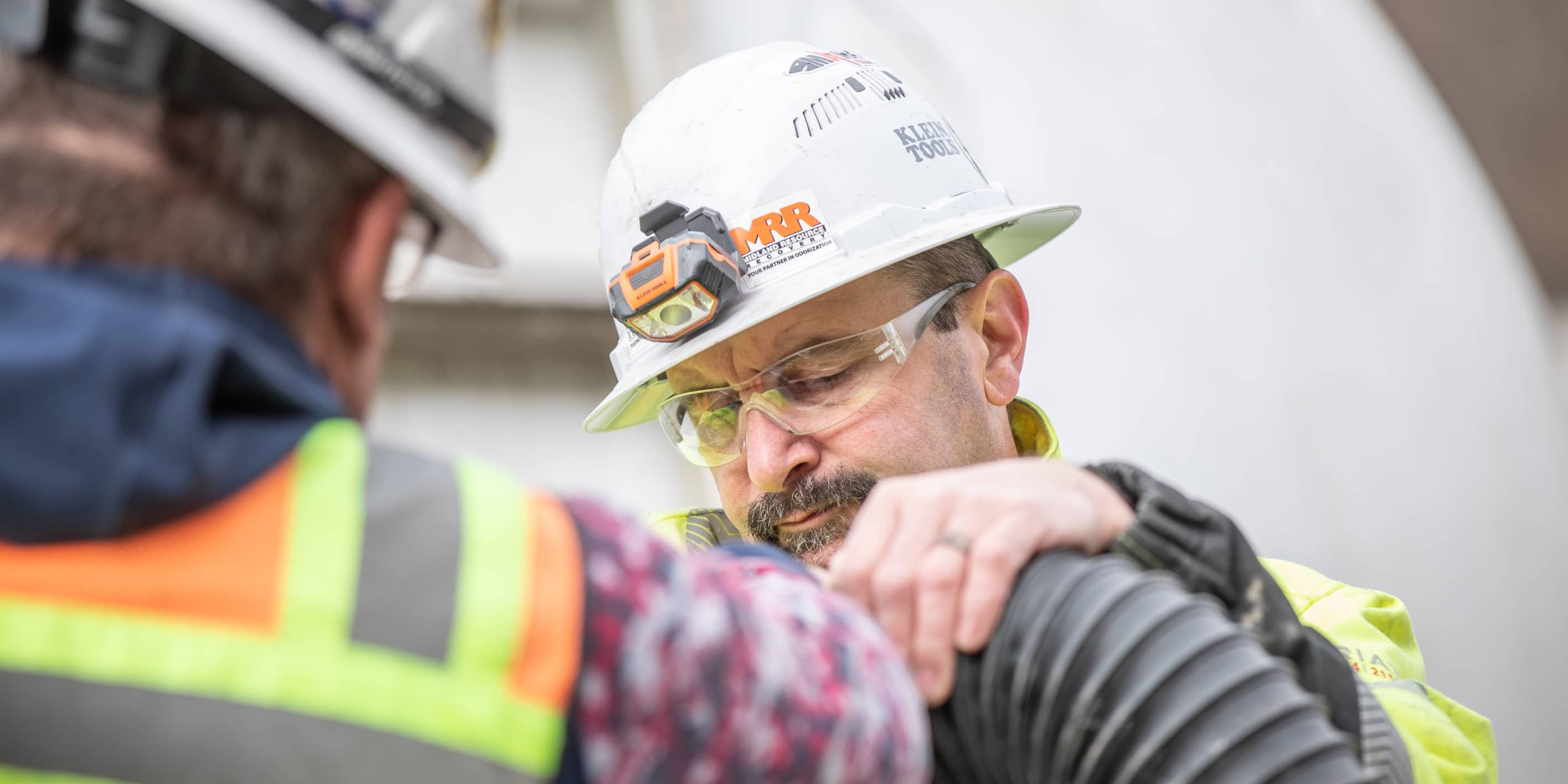 An MRR field technician inspecting odorization equipment at a gas facility