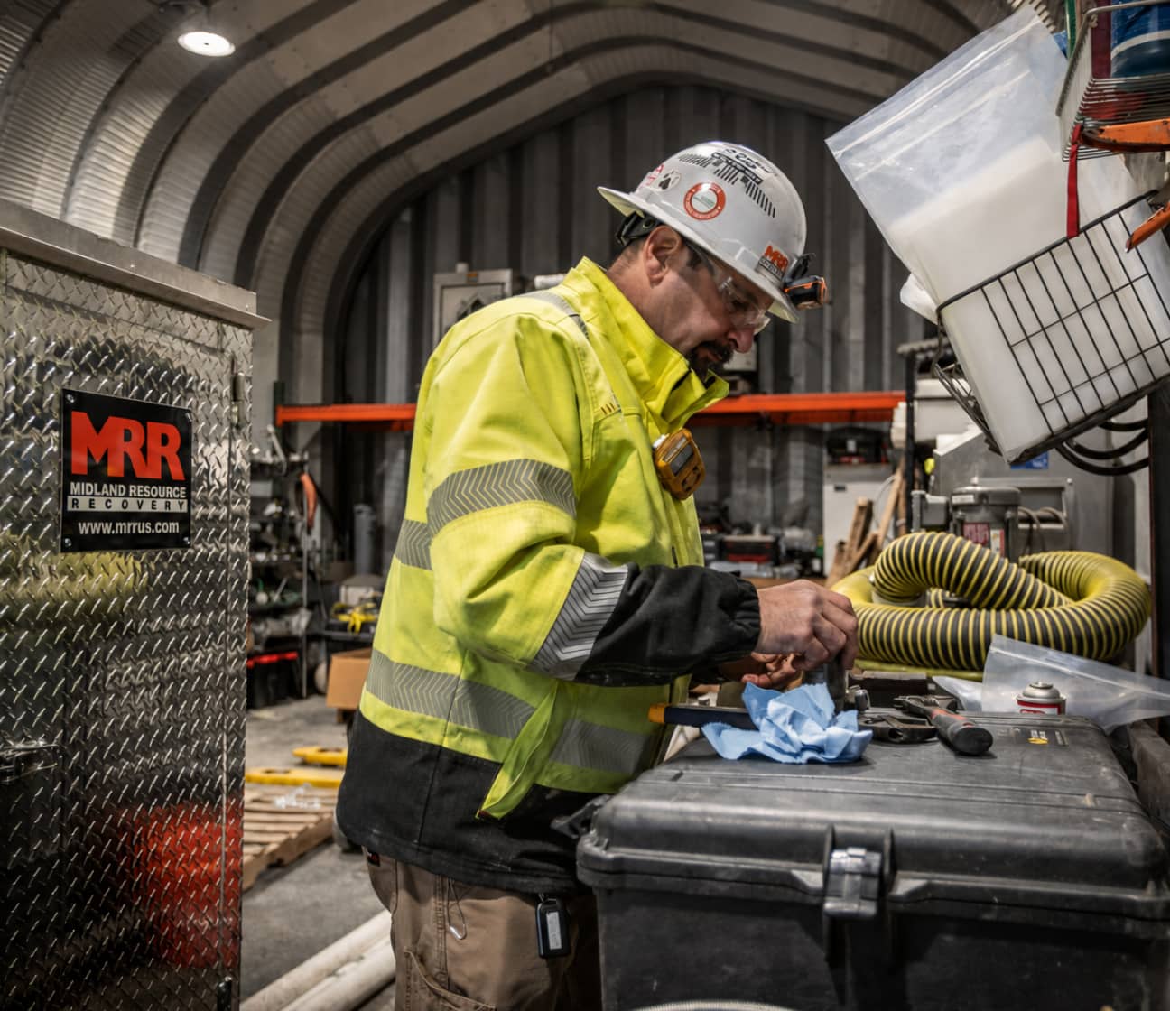 An MRR technician performing field testing on odorization equipment inside a service building, representing the Validate step