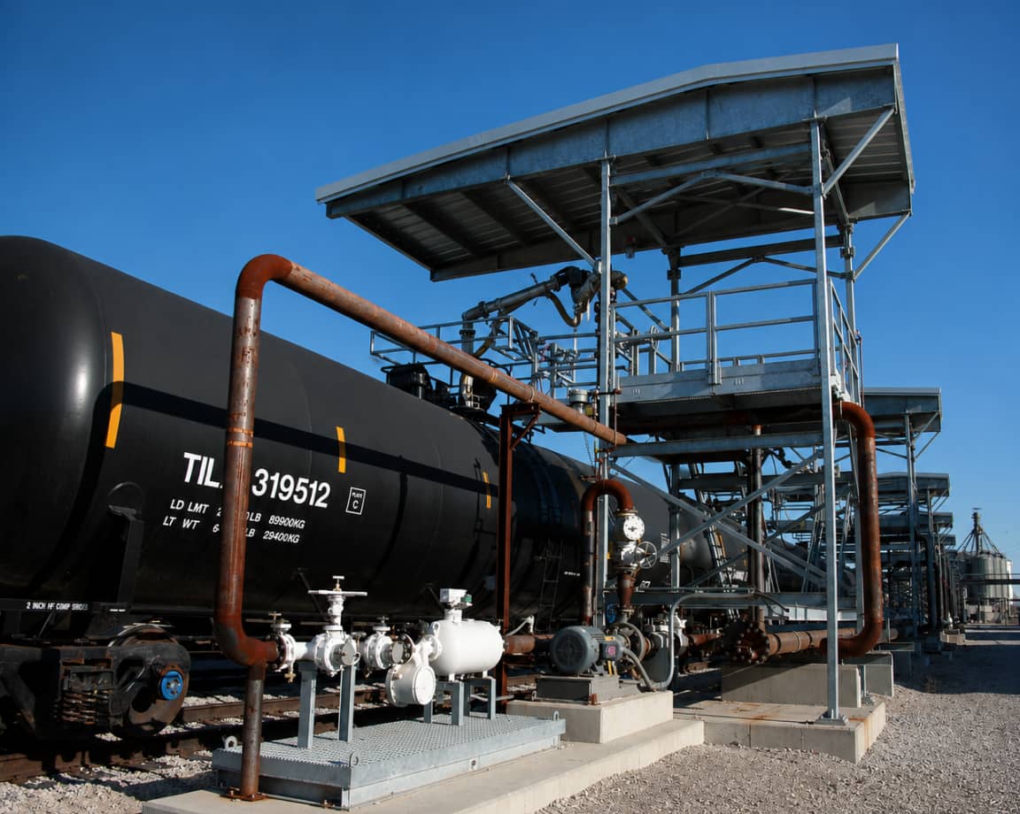 Railcar odorant loading rack with piping and platform at a refinery