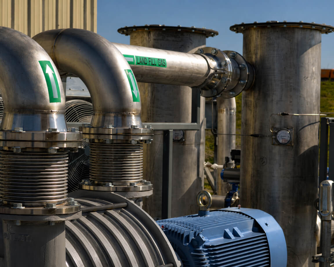 Landfill gas piping and blower equipment at an RNG collection site