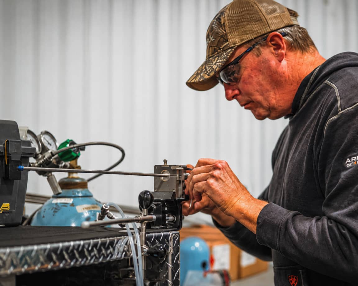 An MRR technician carefully assembling odorization equipment, reflecting the company's Deliberate approach to safety