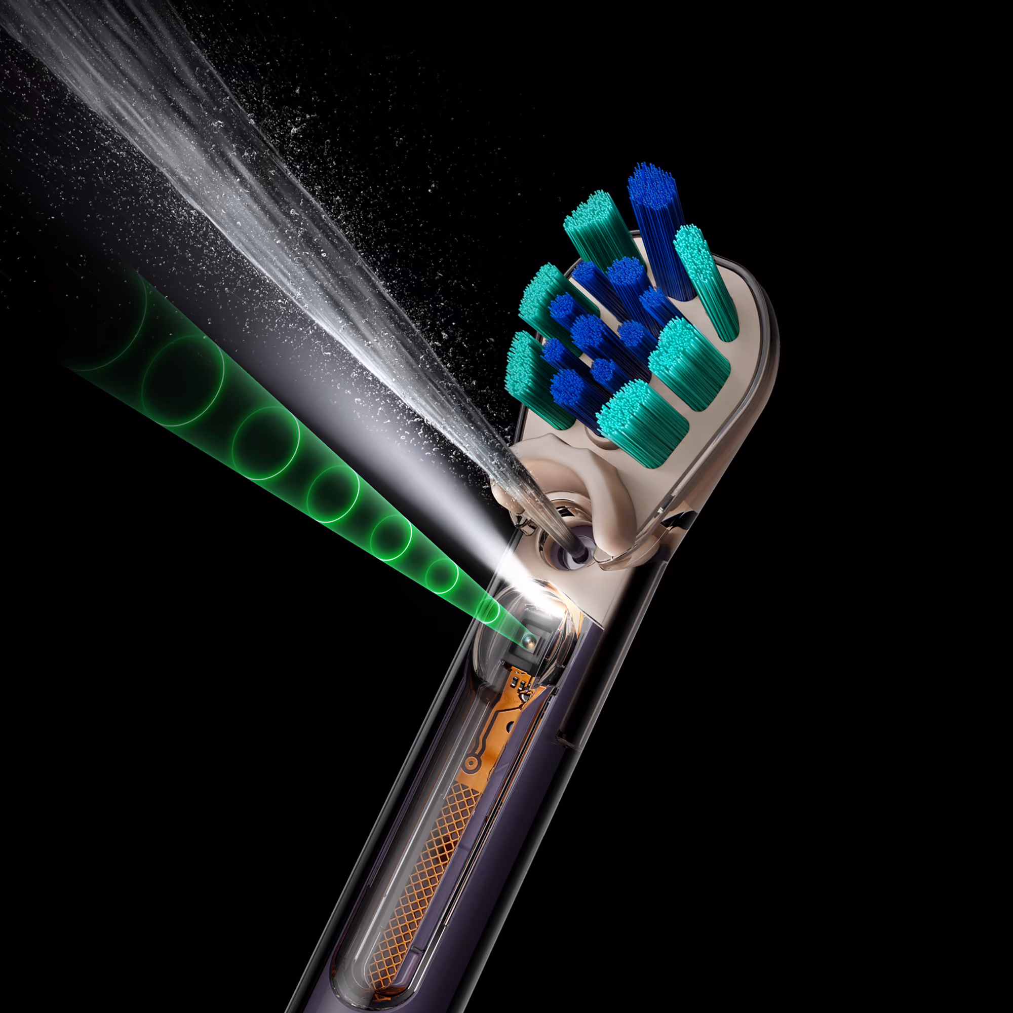 Close-up of the dual-bristle brush head firing a jet of liquid, with a graphic showing the spray's trajectory.