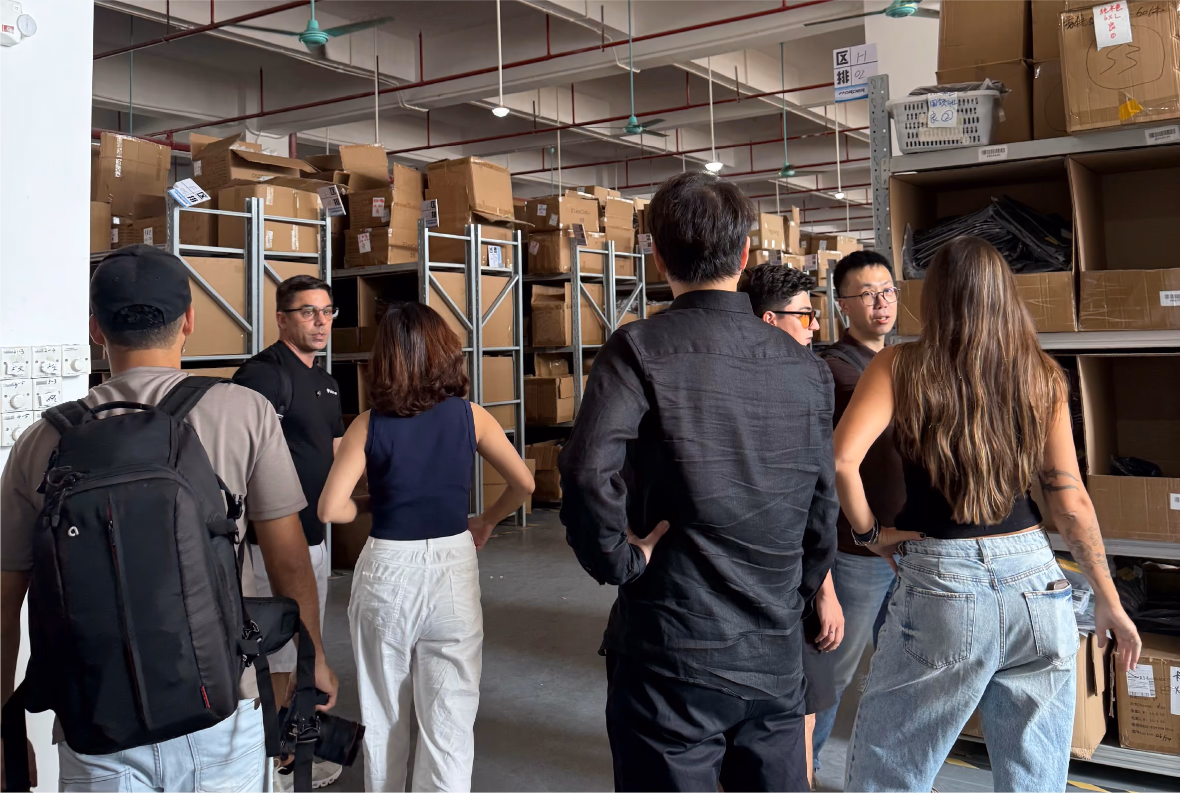 Sourcing specialist and factory engineer reviewing product samples together