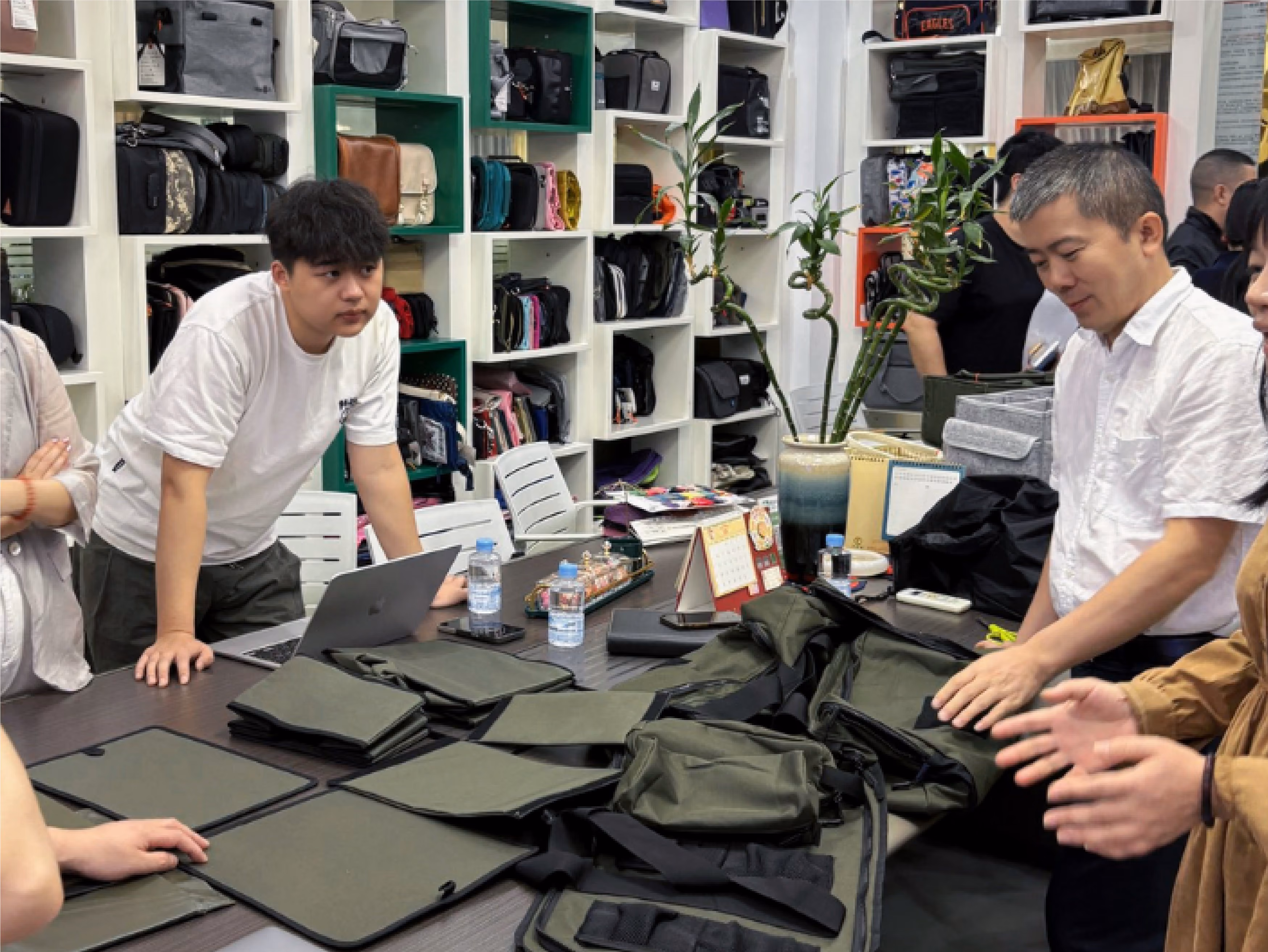 Overseas buyer, interpreter, and engineer discussing the line