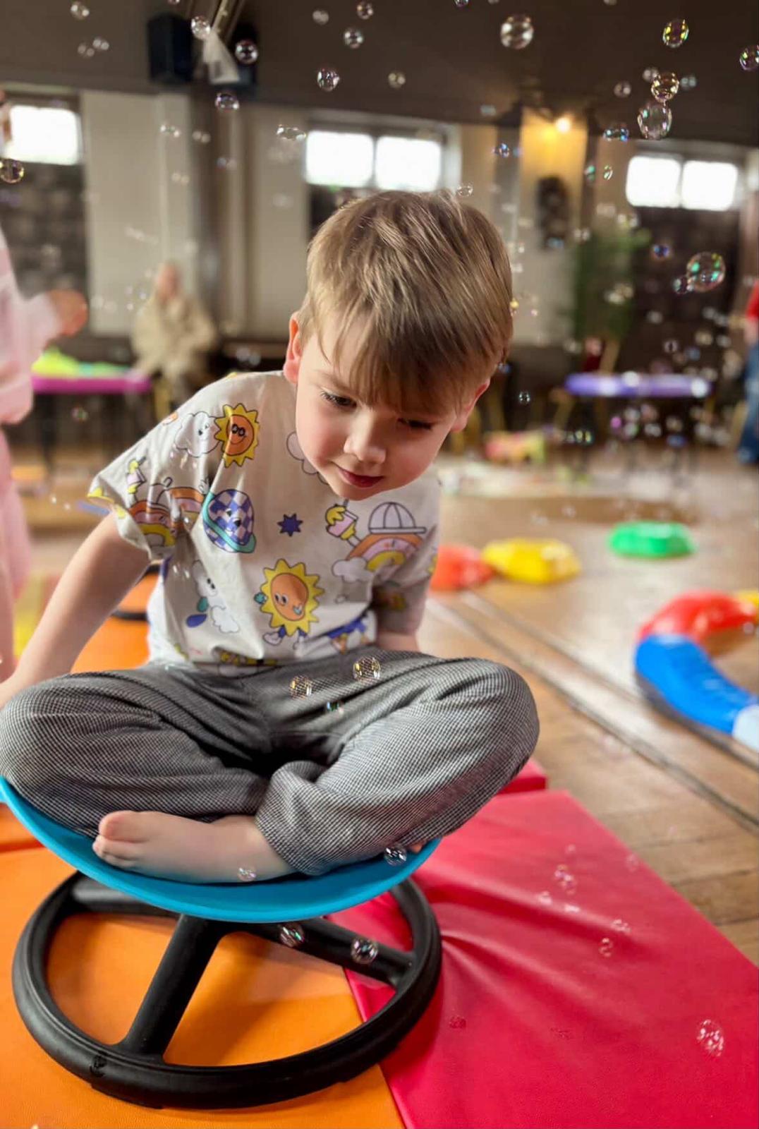 Happy child playing at Fidget and Spin